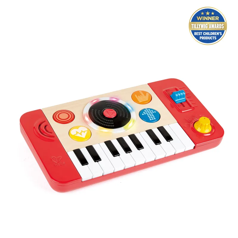 Child playing with Hape wooden musical toys
