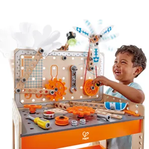 Child playing with wooden tool toys, tightening nuts and screws