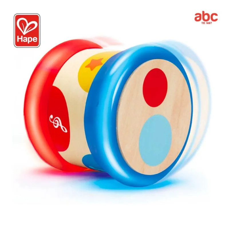 Child playing with Hape wooden musical toys
