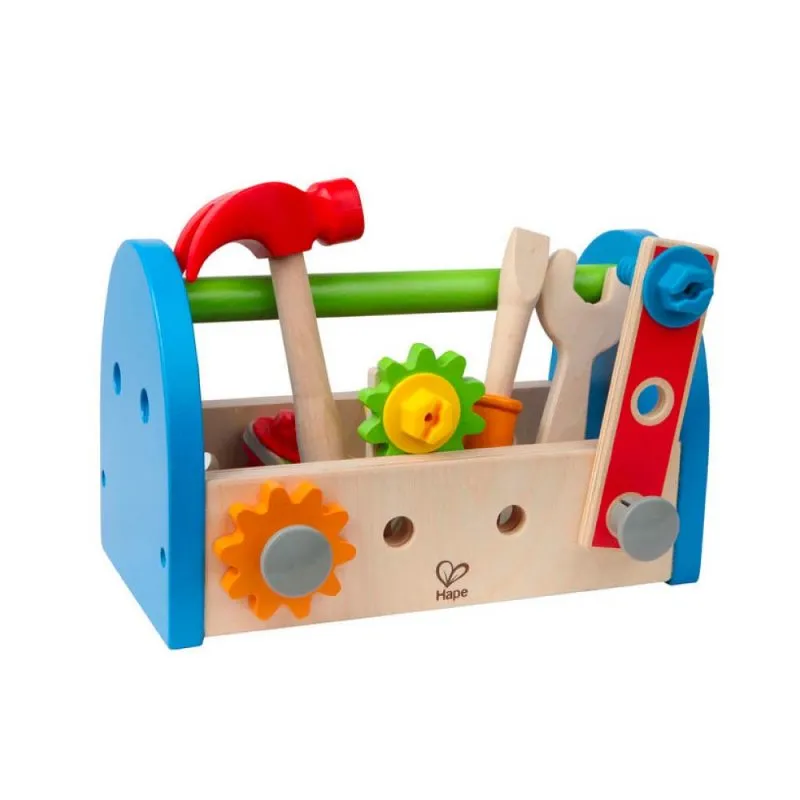 Child playing with wooden tool toys, tightening nuts and screws