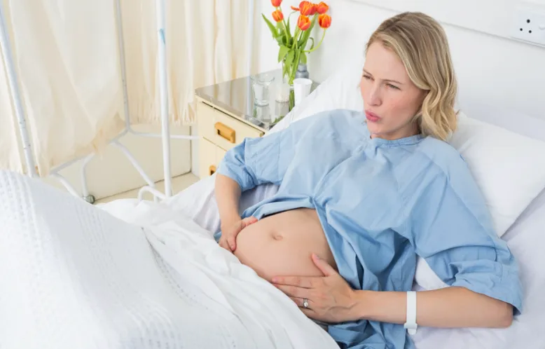 Expectant mother experiencing labor contractions