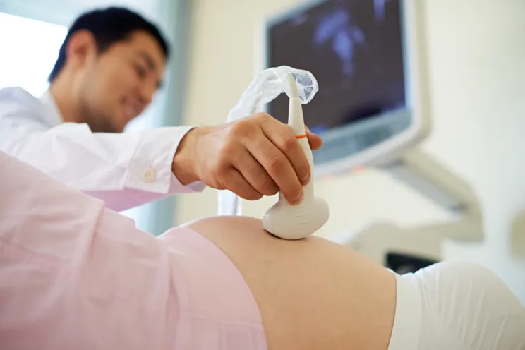 Pregnant mother having an ultrasound as birth approaches