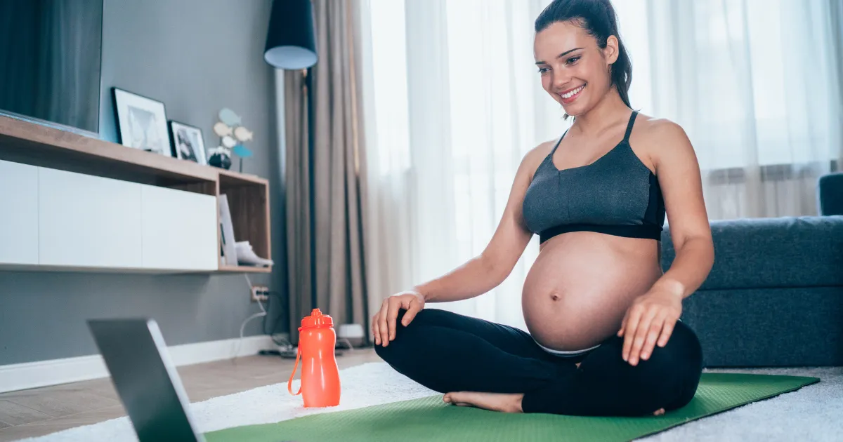 Expectant mother practicing prenatal yoga