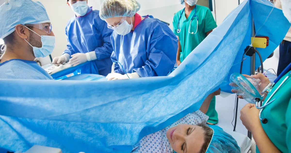 Mother recovering after a C-section with her baby