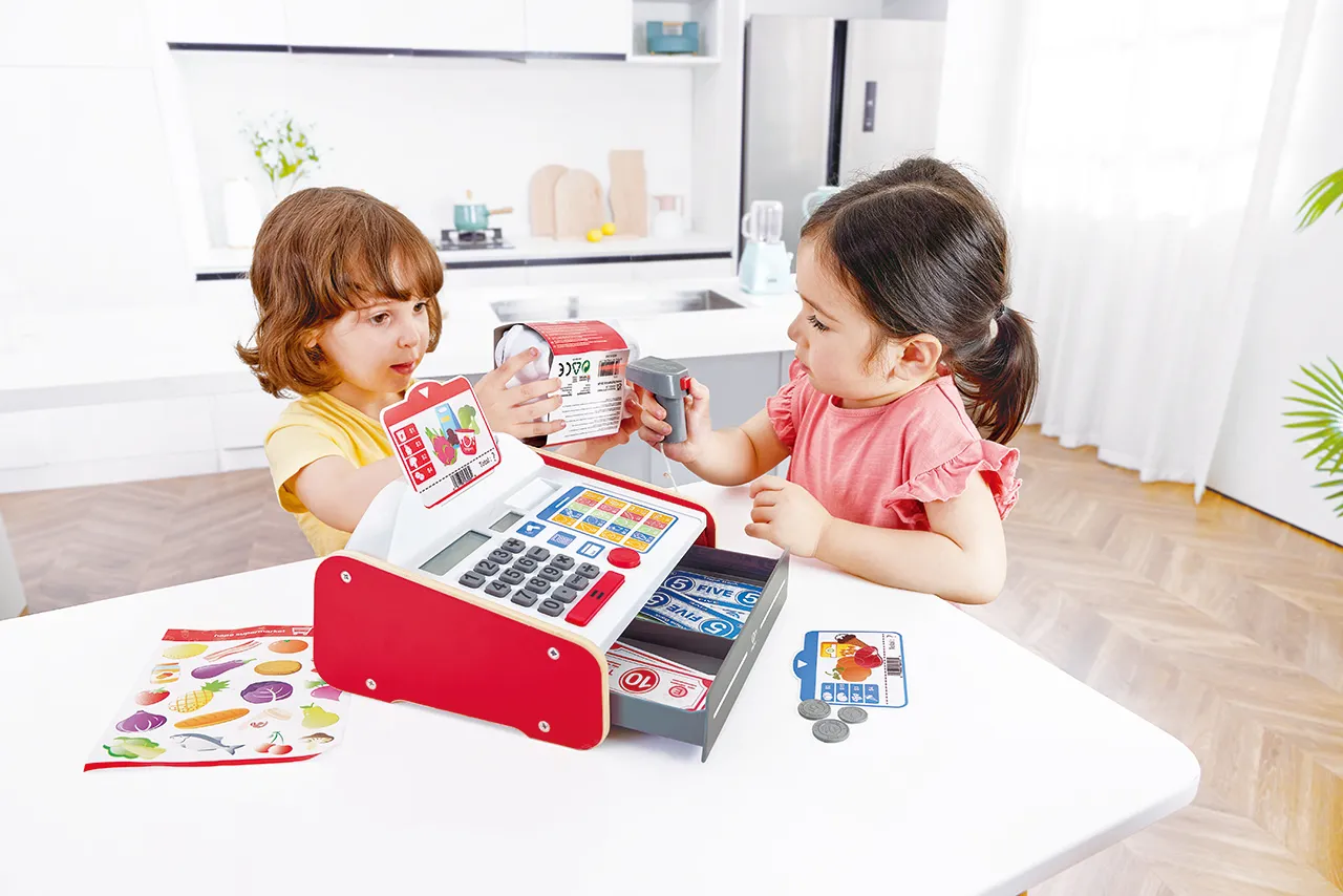A child playing with wooden toys arranged in rotating sets